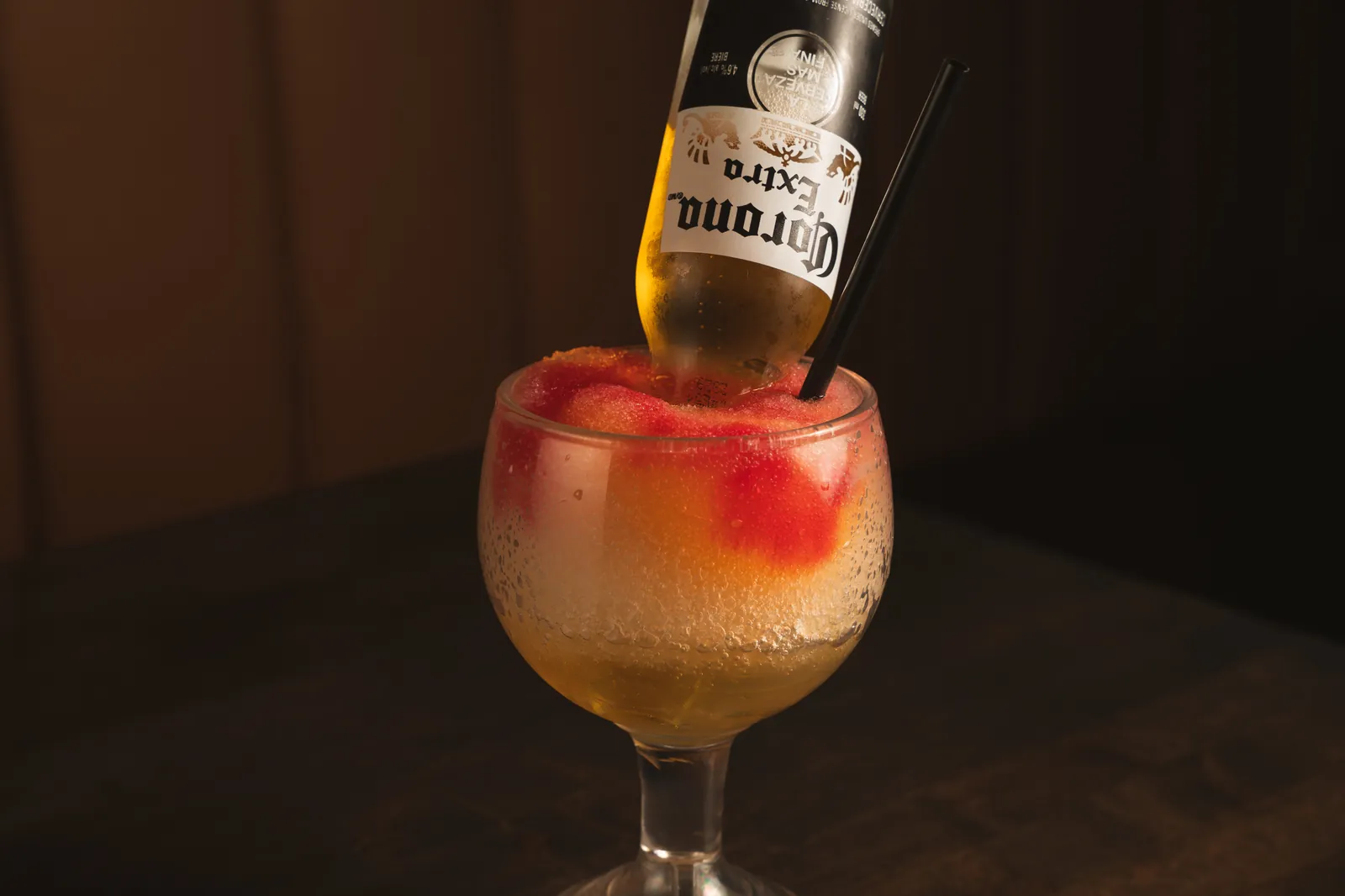A frozen bulldog with a bottle of Corona upended in it